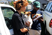 Tacara Maddocks and her dog Bella registering for a rabies vaccination awareness campaign by the department of agriculture and rural dvelopment in KwaZulu-Natal.