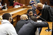 Advocate Malesela Teffo with some of five men accused of the 2014 murder of Bafana Bafana goalkeeper Senzo Meyiwa. File photo.