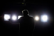 US President Donald Trump departs after speaking at a campaign rally at Southern Illinois Airport in Murphysboro, Illinois, on Saturday. 