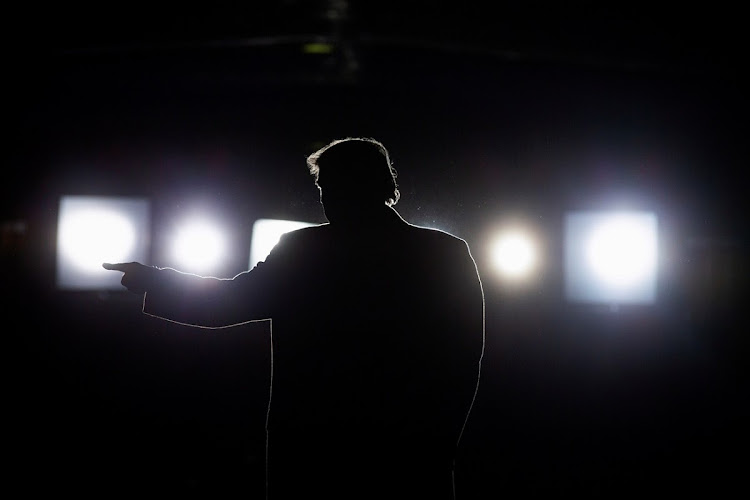 US President Donald Trump departs after speaking at a campaign rally at Southern Illinois Airport in Murphysboro, Illinois, on Saturday.