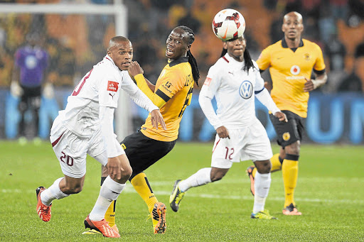 ACE: Swallows' Edward Manqele (left) slips past Chiefs' Reneilwe Letsholonyane in their Premiership match at FNB Stadium in August. Picture: Gallo Images