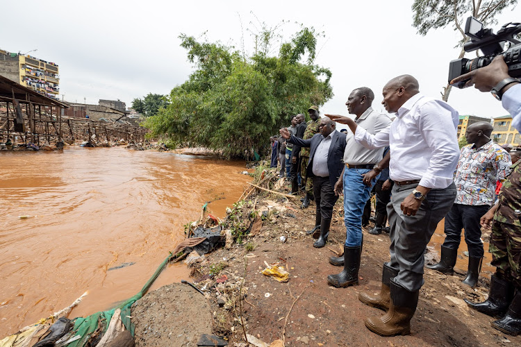 President William Ruto accompanied by other leaders when he visited Kiamaiko to assess the flood situation on April 6, 2024.