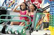 MERRILY GO ROUND: Sisters on the Slipper Ride at the Rand Easter Show at the Nasrec Expo Centre in Johannesburg. The event will include an SANDF weapons exhibit and stunt cars.