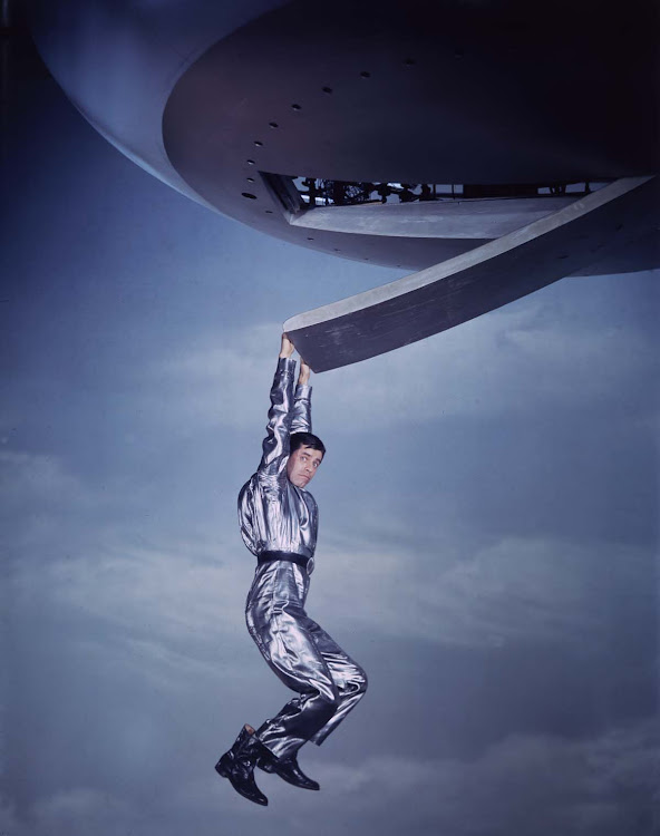 American actor and comedian Jerry Lewis hangs from a spaceship in a silver spacesuit in a promotional portrait from director Norman Taurog's film, 'Visit To A Small Planet', 1960. Lewis, born Joseph Levitch, was born on March 16, 1926 in New Jersey. He died at age 91 from Cardiovascular disease on August 20, 2017, in Las Vegas.