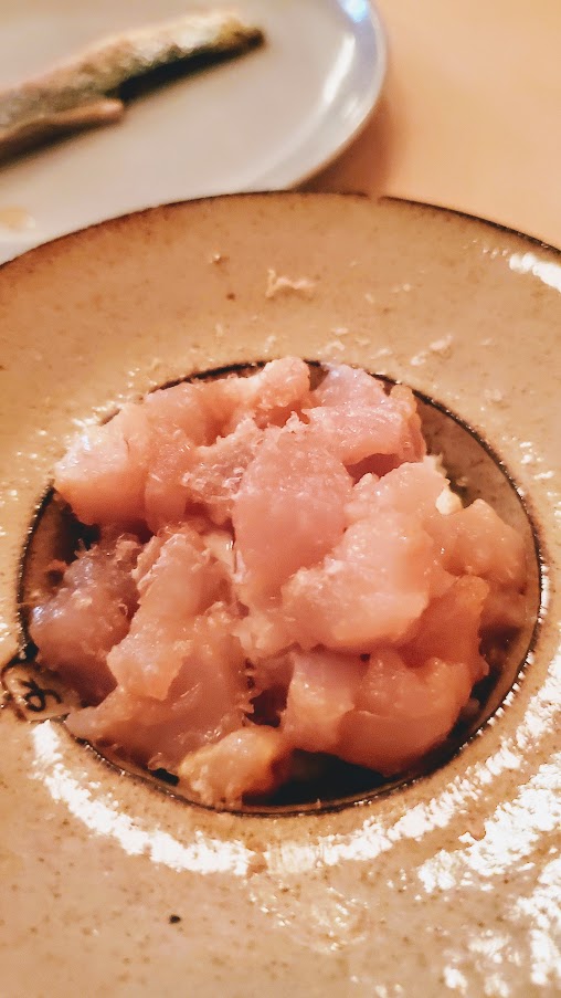 A Dinner at Erizo, albacore tuna and gold rice, and sardine with yuzu. The gold rice here is a special heirloom type that is also aged in Kirin whisky barrels.