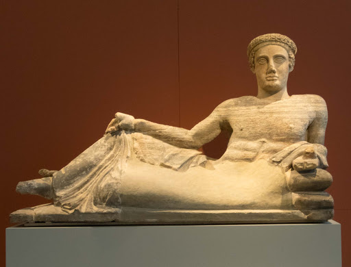 Cinerary-Urn.jpg -   Cinerary Urn: Reclining young man dates to 440-460 B.C. in the Altes Museum in Berlin. 