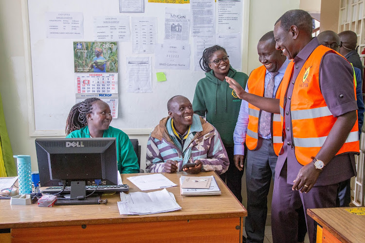 President William Ruto interacts with staff at the National Cereals and Produce Board (NCPB) Eldoret Depot on April 8, 2024