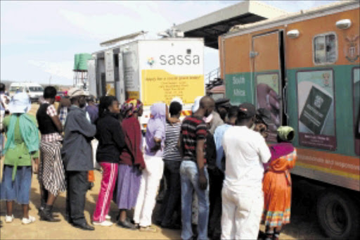 ON THE LINE: People queue in large numbers to apply for child support grants in Limpopo. Pic: MOYAHABO MABEBA. 01/02/2010. © Sowetan.