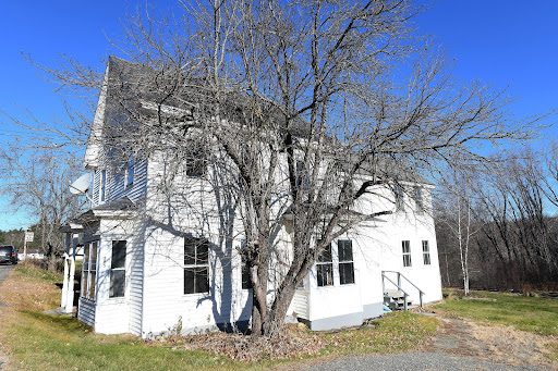 Buy this luxury house in Brownville (United States) - White two-story house bare tree