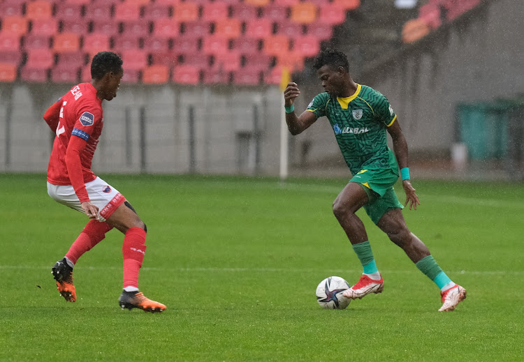 Richard Mbulu of Baroka controls the ball under pressure from Sammy Seabi of Chippa United during their DStv Premiership match at the Nelson Mandela Bay Stadium.