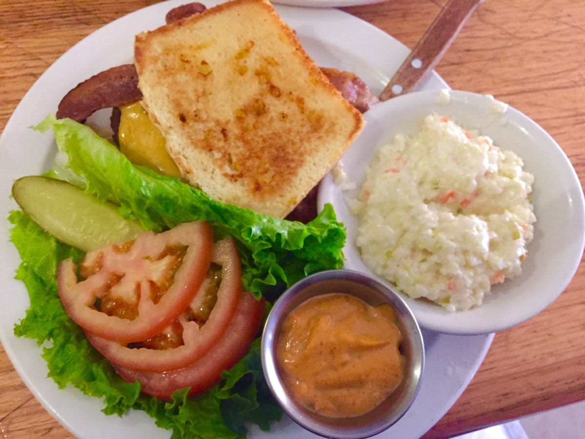 Burger on the garlic GF bread with chipotle mayo, cheddar cheese, lettuce and tomato with a side of coleslaw. The burger was very tasty!