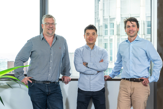 Photo of three men in business attire