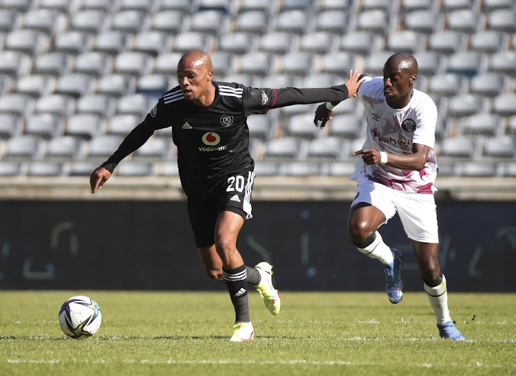 Goodman Mosele of Orlando Pirates challenged by Musa Nyatama of Swallows FC during the DStv Premiership 2021/22 football match between Orlando Pirates and Swallows FC at Orlando Stadium, Johannesburg.