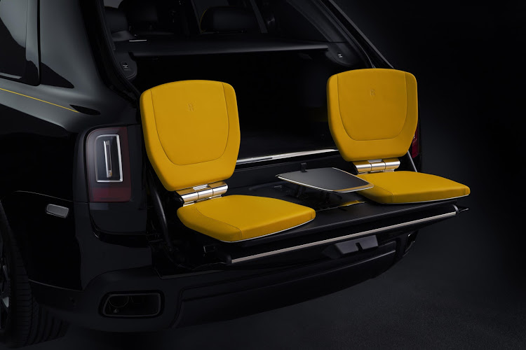 The interior theme, as well as the tailgate seats, can be ordered in this Forge Yellow.