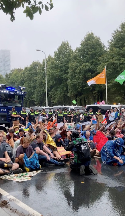 Climate activists protest in The Hague, Netherlands, September 11, 2023, in this screen grab obtained from a social media video.