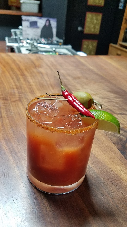 Expatriate Bloody Mary with Monopolowa Vodka, Snap E Tom, Red Boat Fish & Crystal Steak Sauce, XXX Death Sauce, Fresh Lime & Orange, Horseradish, Smoked Salt, Habanero Bitters, Celery Bitters, Indian Spice Rim