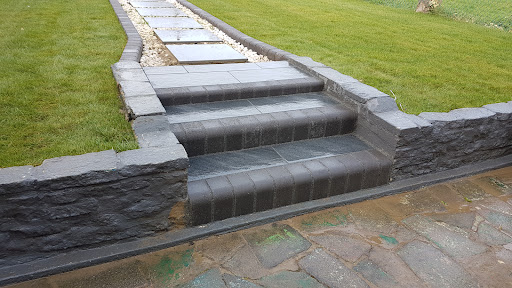 New steps built with charcoal bullnose and porcelain 
