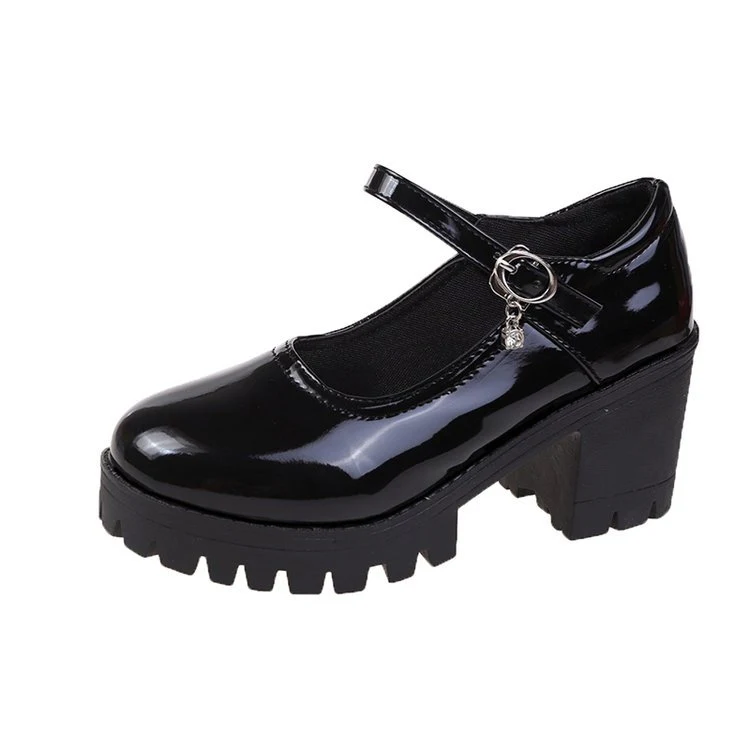 Buckled chunky heel patent leather pumps. Stylish and comfortable shoes for work or special events. Elevate your look wi