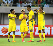 Percy Tau,  Keagan Dolly and  Bongani Zungu celebrate a goal in the 2019 Afcon qualifier against Nigeria.