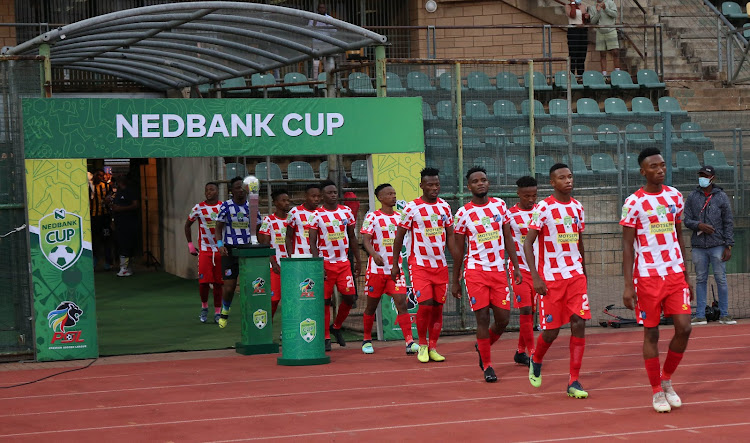 Mathaithai FC players walk onto the pitch at Lucas Moripe Stadum.