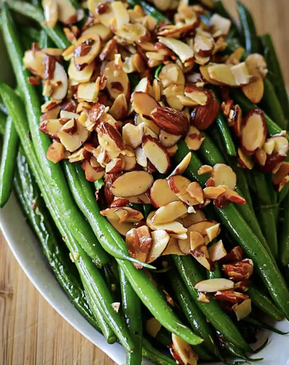 This quick and easy Green Beans Almondine Recipe combines French green beans with toasted almonds, garlic, and little lemon juice for an elegant side dish. 

