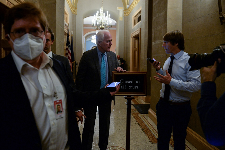 US Sen. John Cornyn talks to reporters after giving a speech on gun safety legislation on the Senate floor in Washington, US, June 23, 2022.