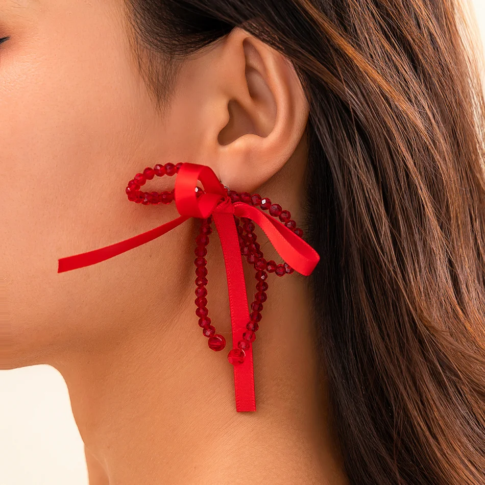 Vrouwelijke oorstekers met strik en knoop, parel, een elegante toevoeging aan elke outfit, perfect voor een subtiele en verfijnde uitstraling.