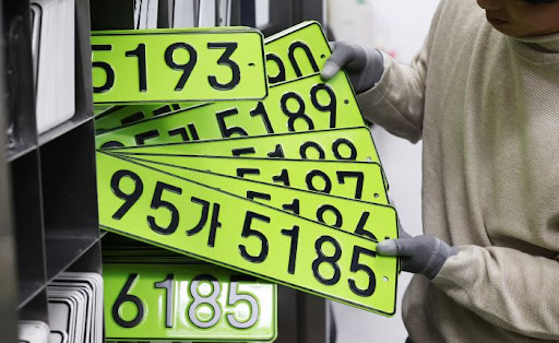 The green plates are said to have dampened the spirits of buyers purchasing luxury cars.