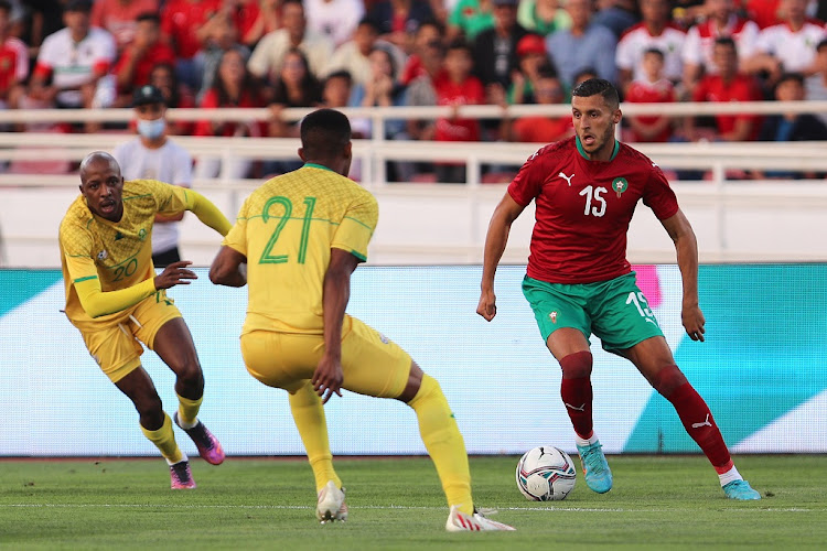 Selim Amallah of Morocco attempts to get past Bafana Bafana's Grant Kekana in the 2023 Africa Cup of Nations qualifying match at Stade Prince Moulay Abdallah in Rabat, Morocco on June 9 2022.