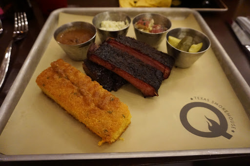 Q_Ribs.JPG - Speaking of food, the new Q Texas Smokehouse serves up authentic Southern barbecue nightly and also hosts live music for those late-night country music fans.