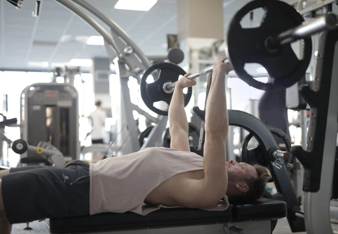 man doing a Chest Shoulder Tricep Workout