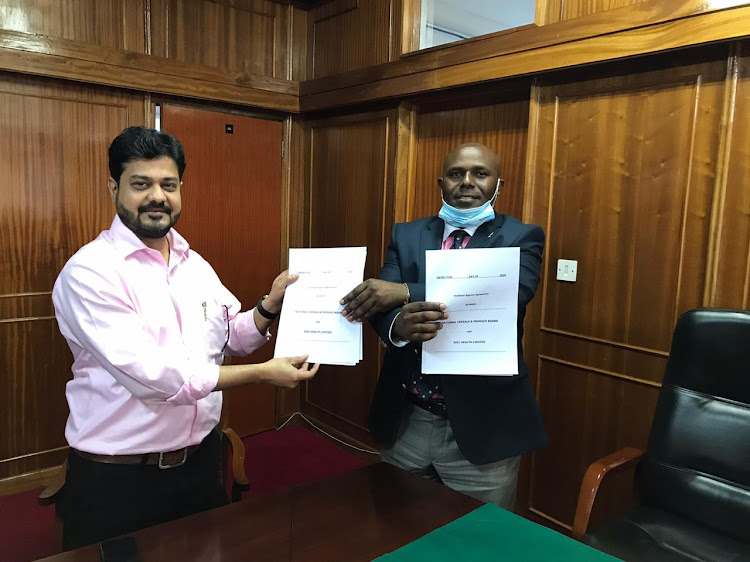 Jigar Chokshi, the Soil Health MD and NCPB MD Joseph Kimote after signing the agreement in NCPB headquarter.