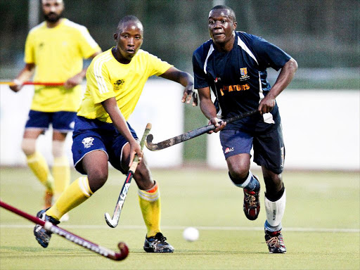 Sikh Union’s Hosea Waluch tries to challenge Strathmore’s Edwin Wanyama in a past match / COURTESY