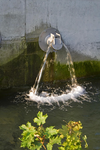 Sewage gushing into a dam.