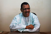 Niger's foreign minister Mohamed Bazoum sits at his desk at his political party headquarters in Niamey, on September 14 2013. 