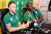 SA national cricket team captain Faf du Plessis (L) and head coach Ottis Gibson addresses the media during a departure press conference at Powerade Centre of Excellence in Pretoria on May 18, 2019.