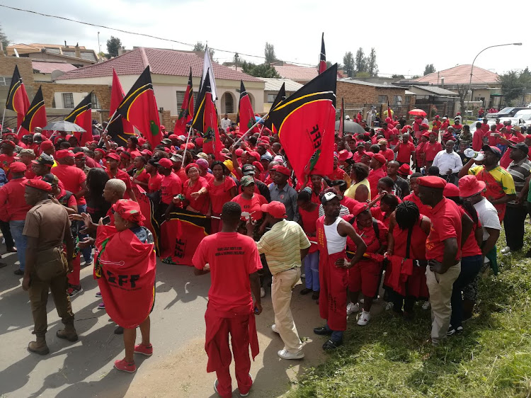 Members of the EFF approach Winnie Madikizela-Mandela's family home in Orlando, Soweto. Party leader Julius Malema has also arrived.