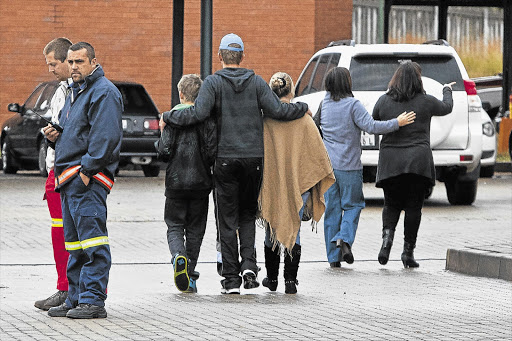 Family of one of the people who died in the Tzaneen plane disaster leave the Crisis Managment Centre after the wreckage of two light aircraft was found yesterday morning