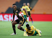 Bernard Parker of Kaizer Chiefs is tackled by Siyavuya Ndlovu of Golden Arrows in the DStv Premiership match between at FNB Stadium on March 19 2022.