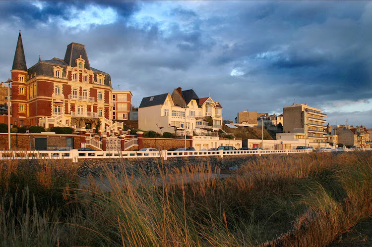 Buildings along the promenade of Le Havre, France, at dusk.