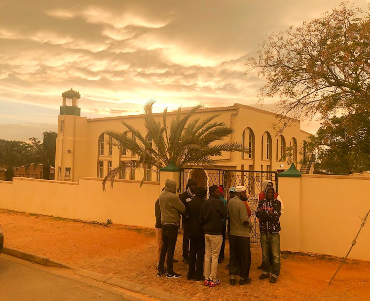 Muslims gather outside Malmesbury mosque in Cape Town on June 14 2018.