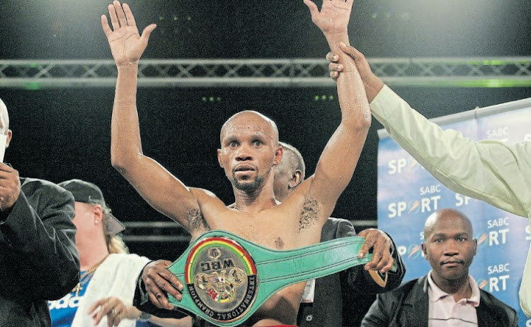 Title holder Hawk Makepula celebrates during the WBC junior bantamweight title fight against Jun Talape of the Philippines at the Graceland casino in Secunda in 2006.