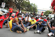 Students gather in the street to honour the memory of Mthokozisi  Ntumba who was killed when police used force to disperse student protesters outside the Wits University campus in Braamfontein, Johannesburg. The protests were sparked by government plans to cut back on student funding. 