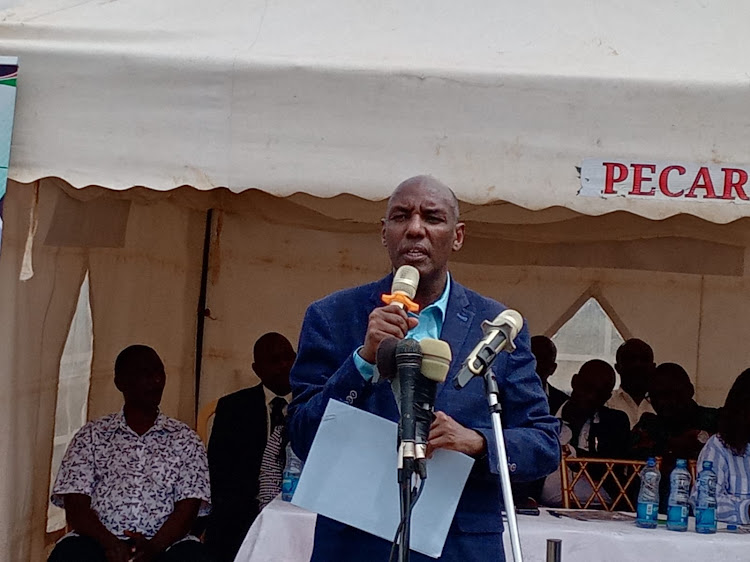 Agriculture Principal Secretary Kello Harsama addresses farmers during the event.