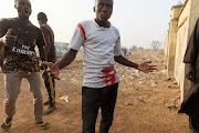 A man reacts as a riot broke out after the arrival of the rescued JSS Jangebe schoolgirls in Jangebe, Zamfara, Nigeria March 3 2021. 