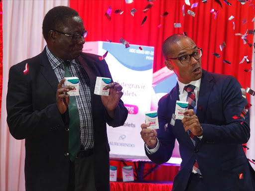 Ministry of Health official Peter Kimuu with Unitaid’s Robert Matiru during the launch of HIV/Aids dolutegravir drug in Nairobi on June 28, 2017 / JACK OWUOR