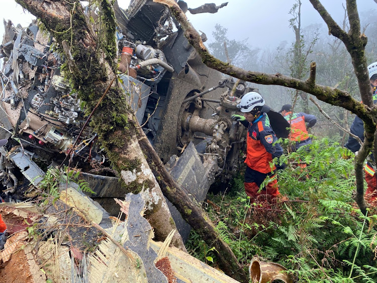 A rescue team searches for missing military officers, after a Black Hawk helicopter made a forced landing at a mountainous area near Taipei, Taiwan January.