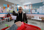 A voter casts his ballot at a polling station during the second round of the parliamentary election in Tunis, Tunisia January 29, 2023.