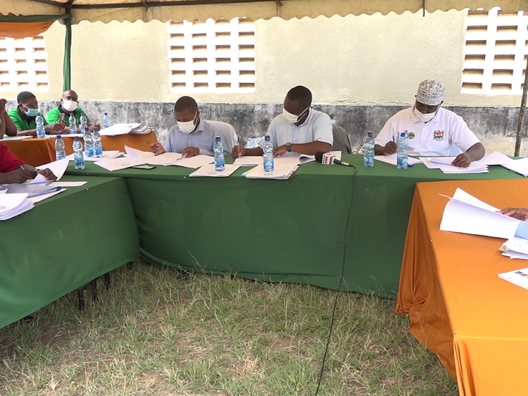 Members of the Kilifi County Valuation Court during a session at the Takaye Mulipurpose Hall.