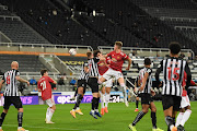 Harry Maguire of Manchester United scores his team's first goal during the Premier League match between Newcastle United and Manchester United at St. James Park on October 17, 2020 in Newcastle upon Tyne, England. 